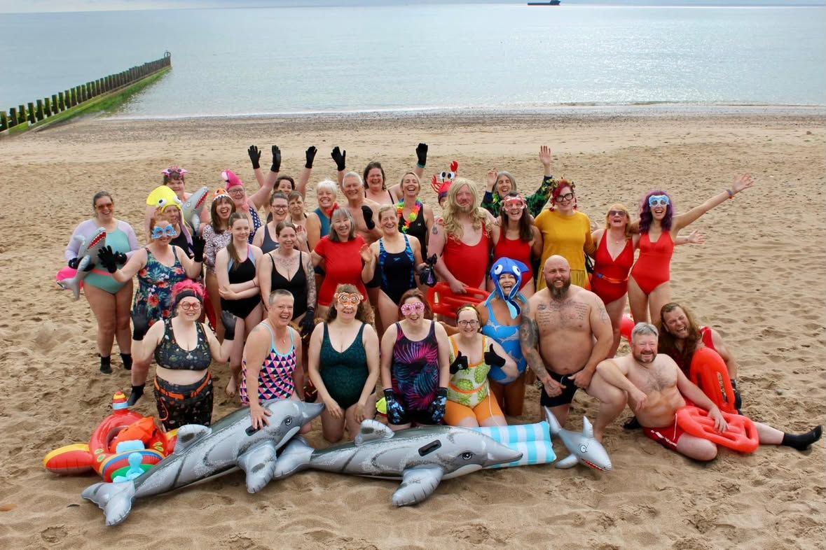 The Daily Dip 4 Dave community on the beach