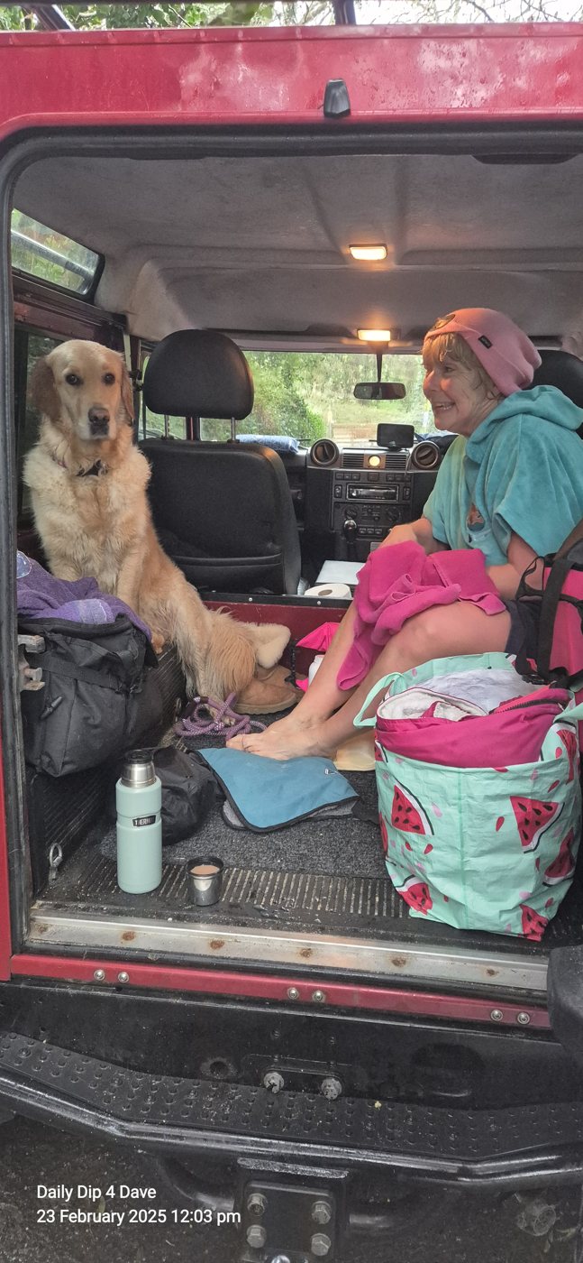 Ruth and her dog, tired and happy after a swim