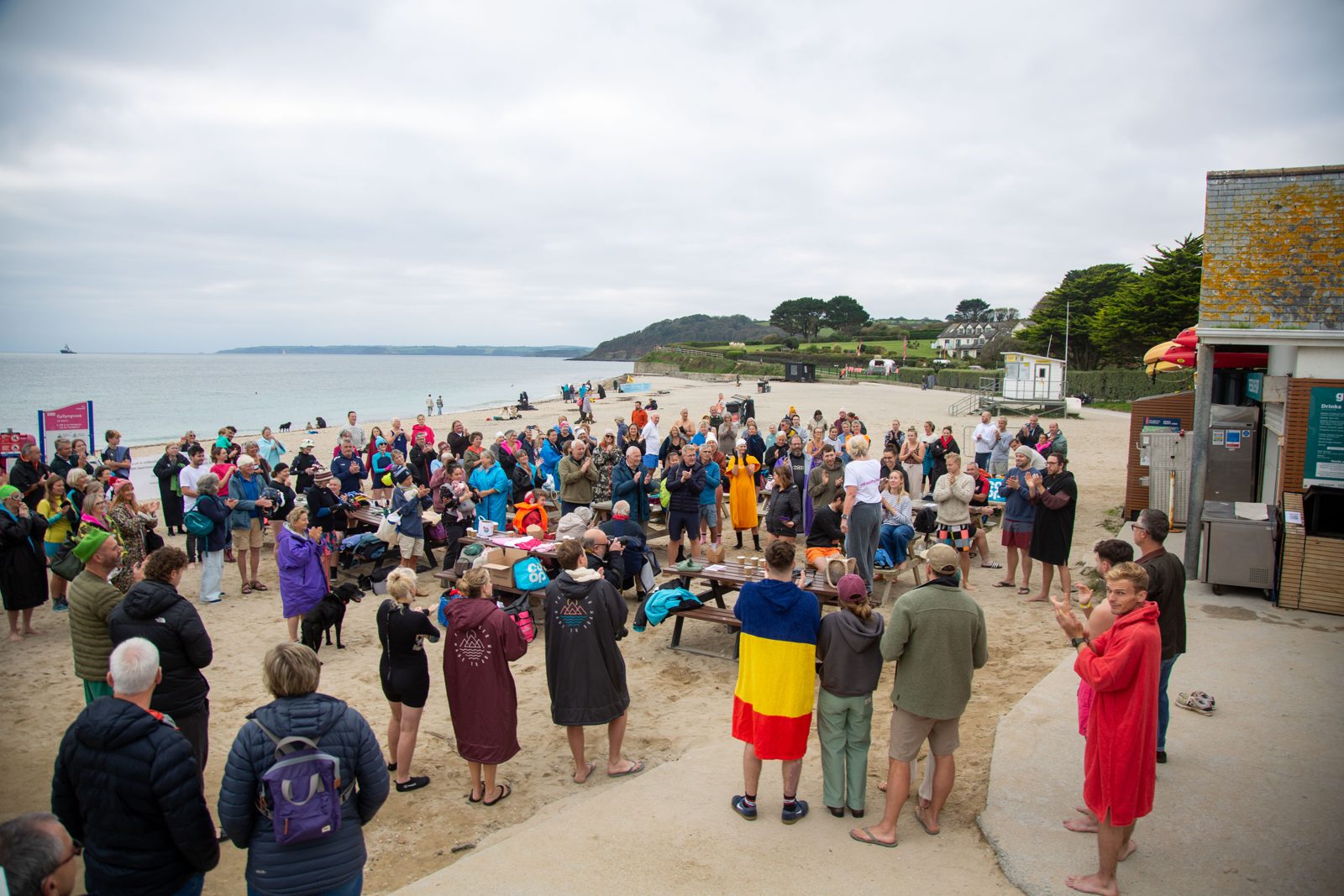 The Daily Dip 4 Dave community gathered on the beach at Gylly