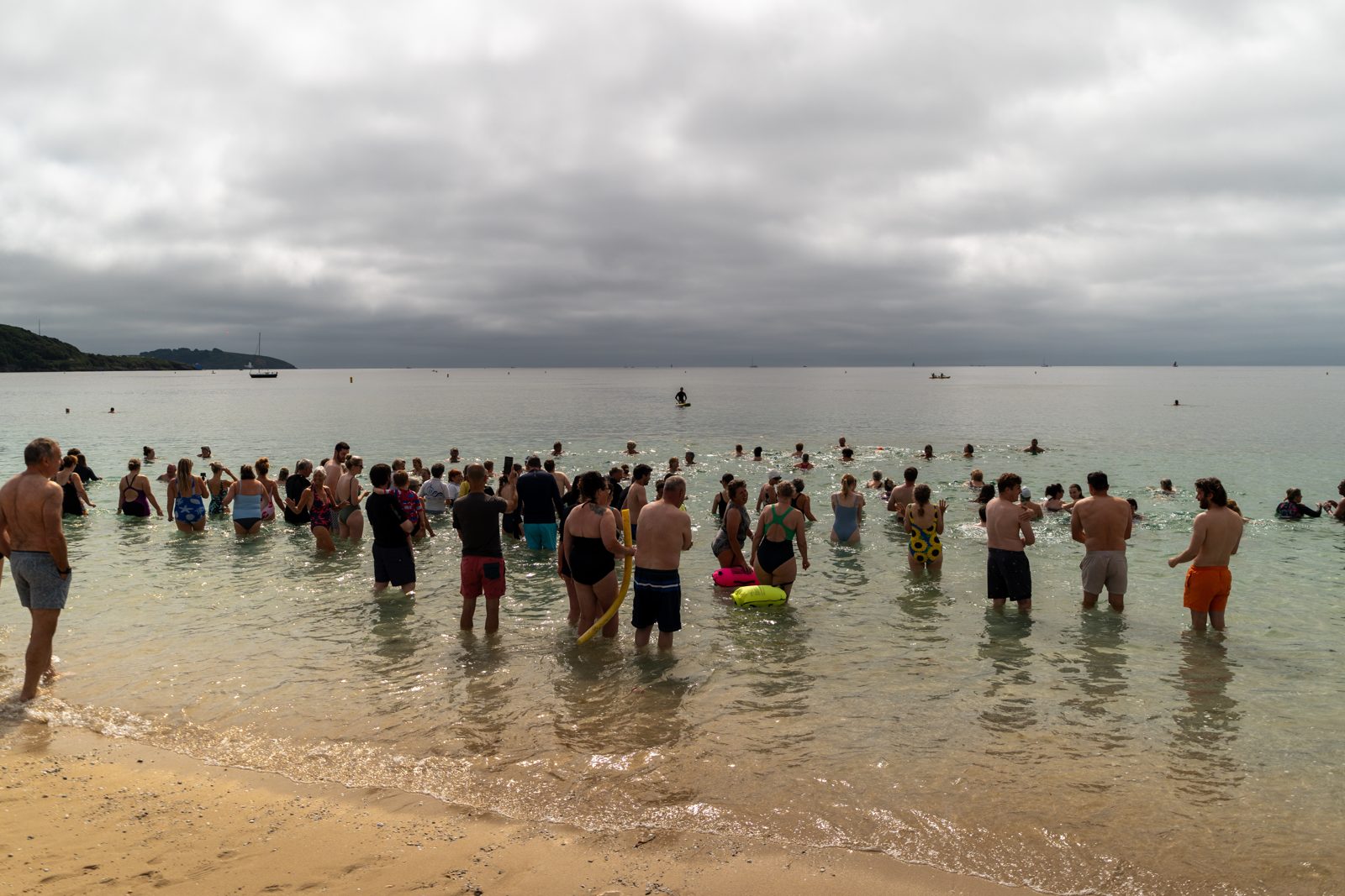Swimmers wading into the sea together for National Daily Dip 4 Dave Day