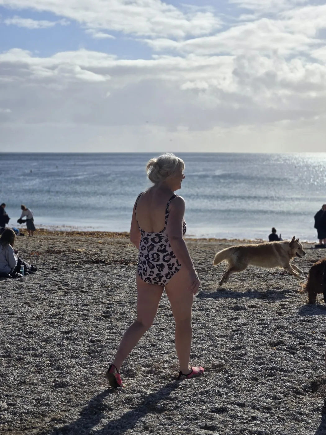 Ruth walking down the beach towards the sea