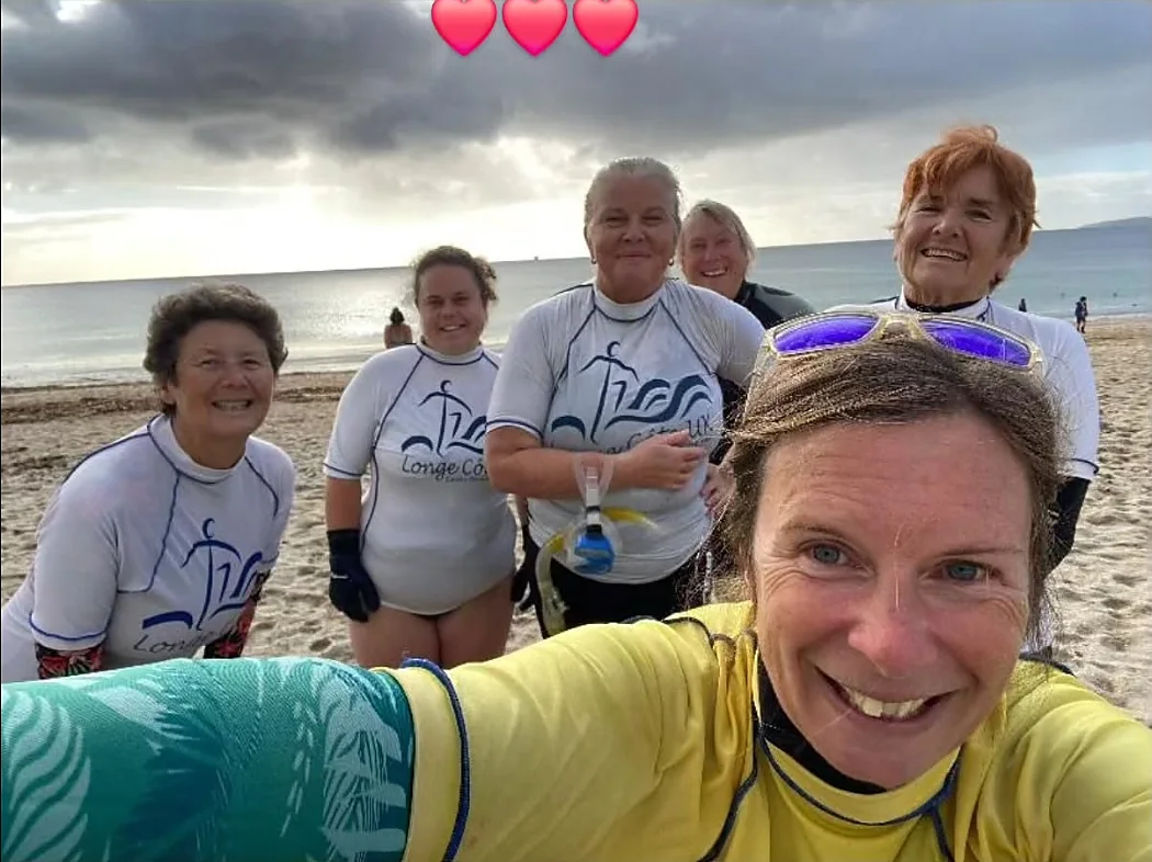 A group of Longe Cote swimmers on the beach